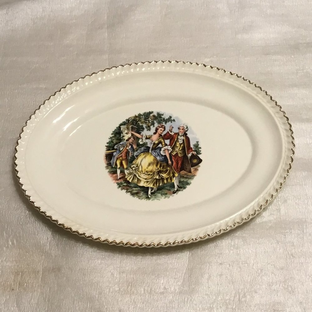 Vintage 22 kt gold rimmed oval platter w/ Victorian scene by Harker Pottery Co.